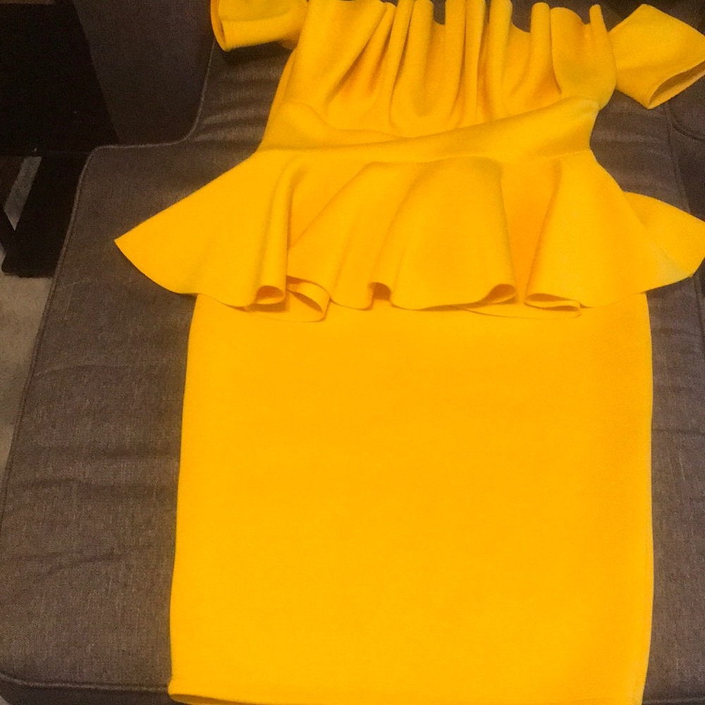 This is a body con peplum dress